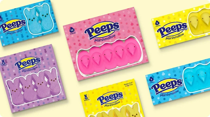 A variety of Peeps Marshmallow Chicks in blue, purple, pink, and yellow colors.